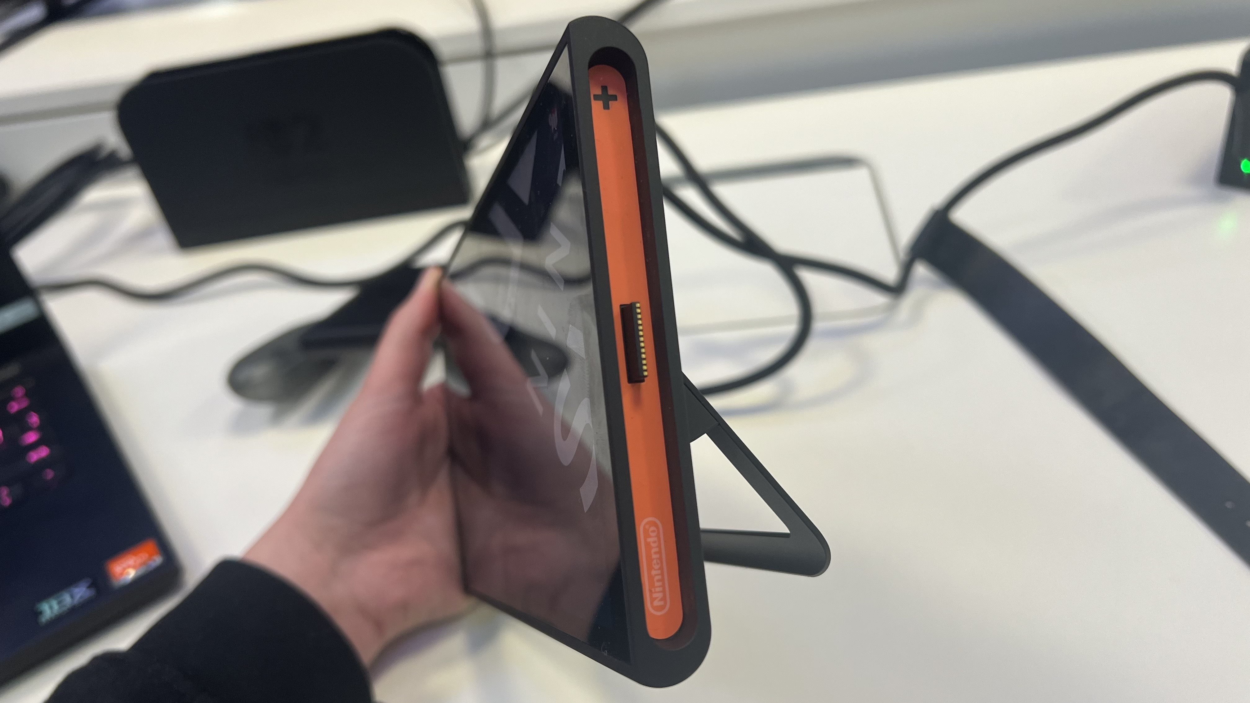 Side of Nintendo Switch 2 tablet with Joy-Con connector protruding outwards