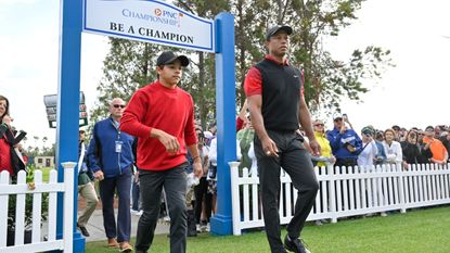 Charlie and Tiger Woods during the PNC Championship at the Ritz Carlton Golf Club 