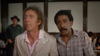 Gene Wilder and Richard Pryor looking shocked in a courtroom in Stir Crazy