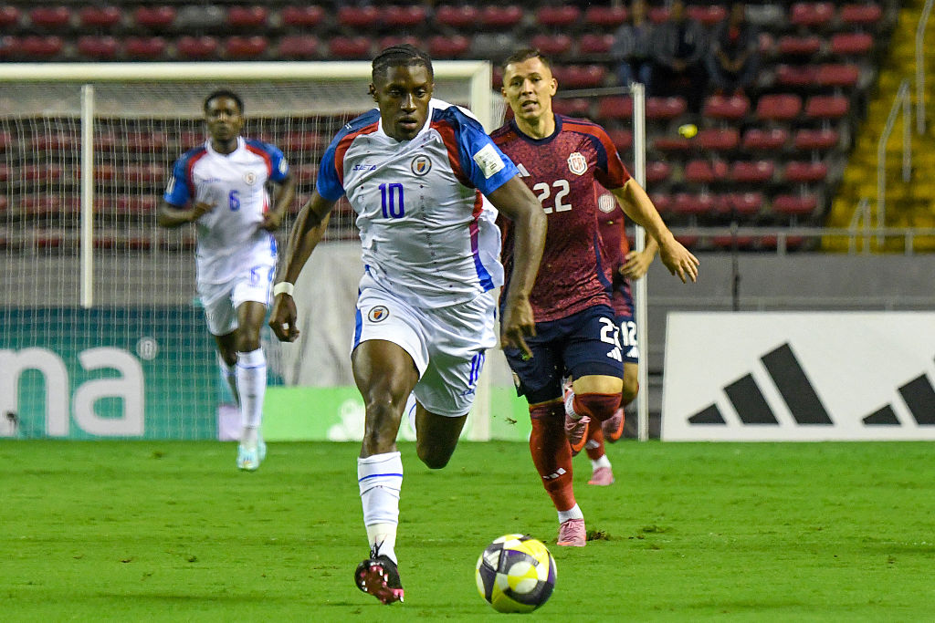 Haiti&#039;s midfielder #10 Jean-Ricner Bellegarde runs with the ball past Costa Rica&#039;s forward #22 Carlos Mora during the 2026 FIFA World Cup Concacaf qualifier football match between Costa Rica and Haiti at the National Stadium in San Jose on September 9, 2025.