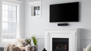 TV above white fireplace