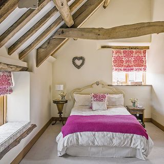 bedroom with white wall and bed