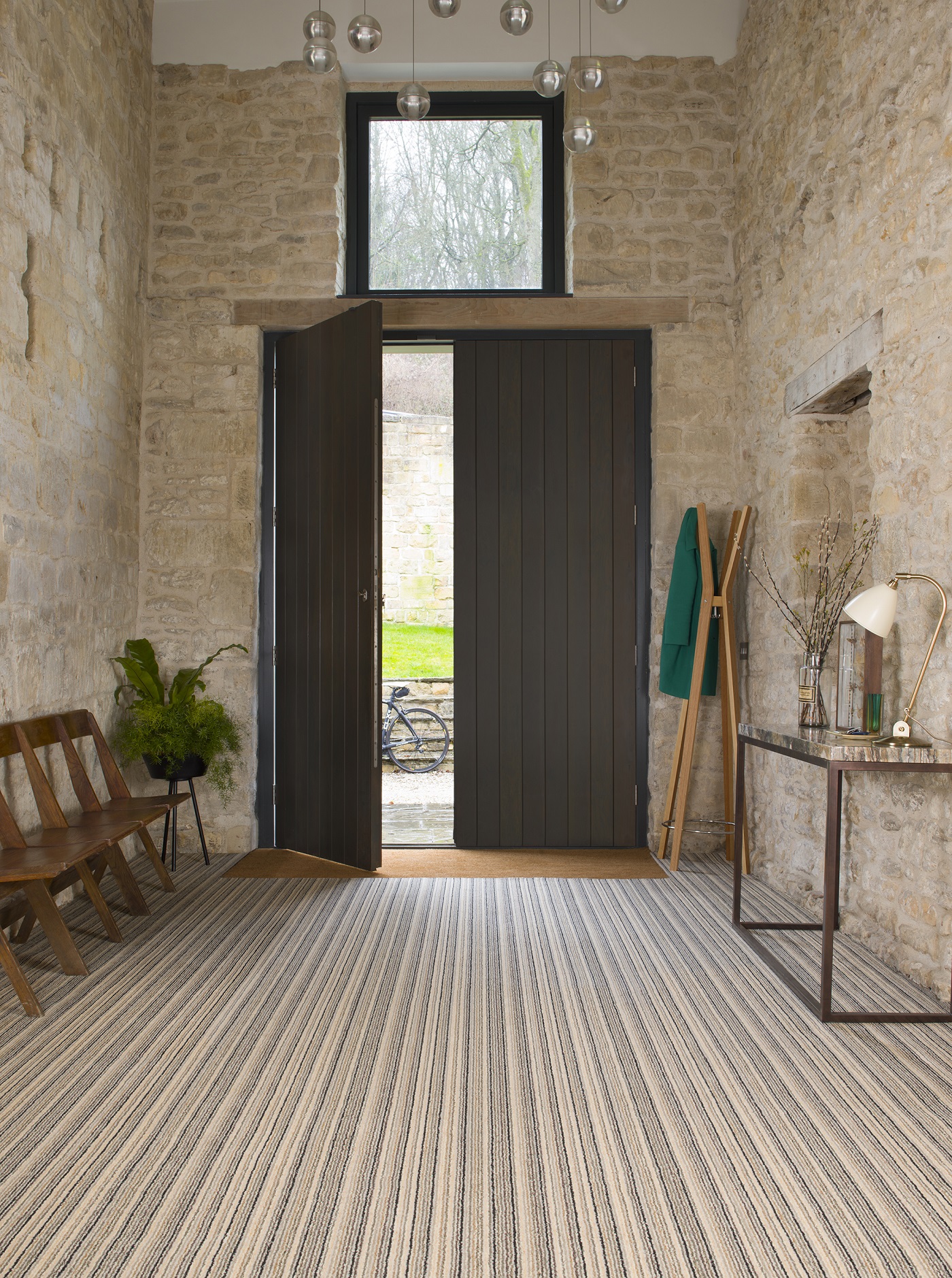 Hallway with door open and carpet