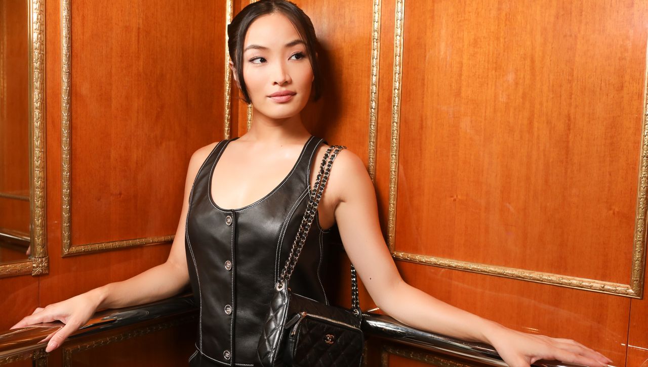 Anna Sawai wears a Chanel cruise leather set in an elevator while on her way to the couture show