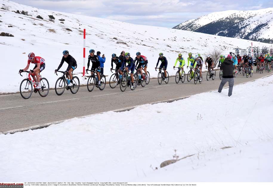 The road is one of the few things not covered in snow during this Volta a Catalunya stage