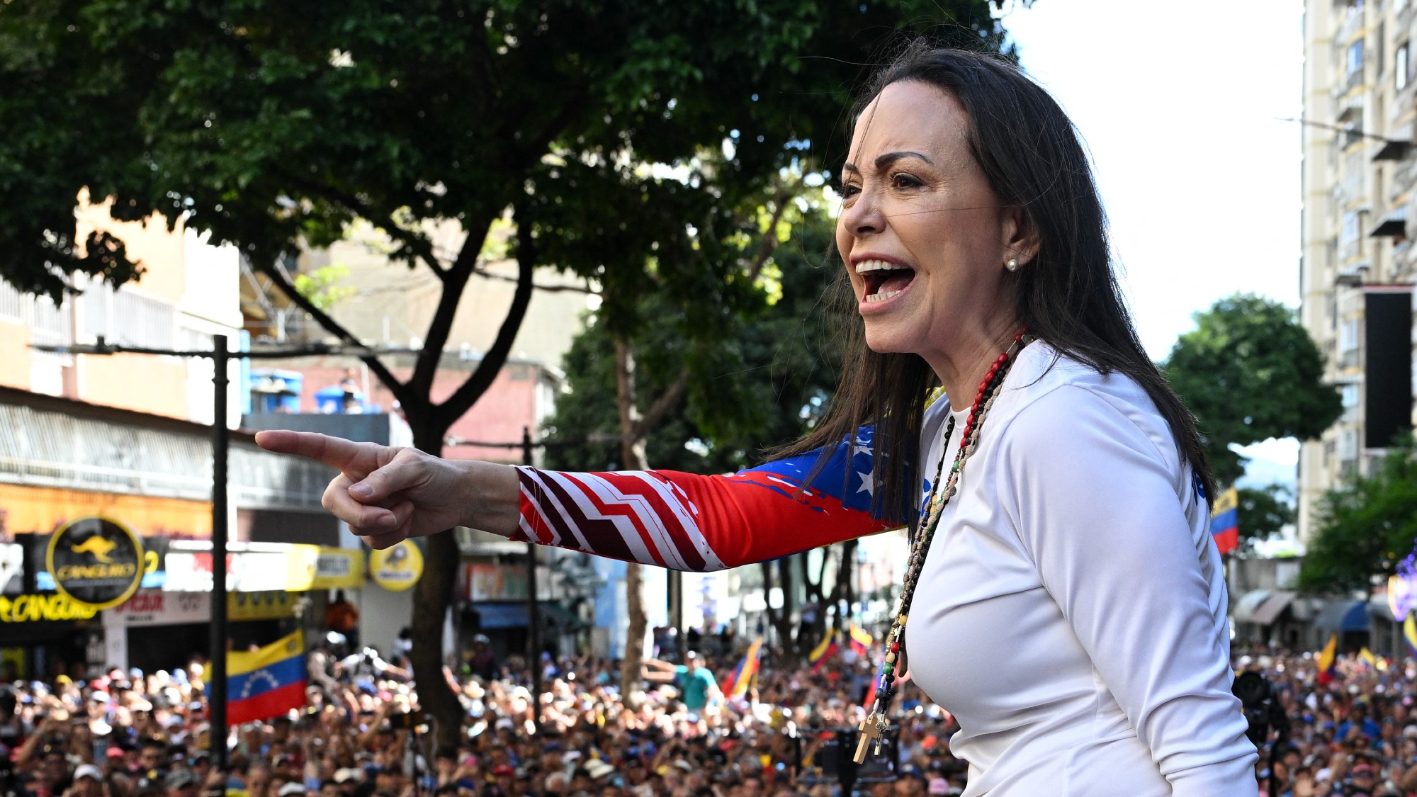 Maria Corina Machado addresses supporters during a protest