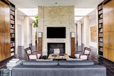 mid-century style living room with brick fireplace