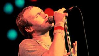 Phil Collins performing onstage in 1980