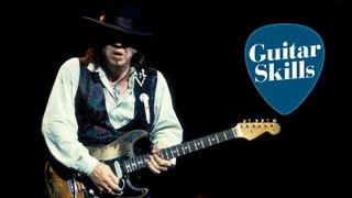 Stevie Ray Vaughan plays guitar as he performs onstage at the Alpine Valley Music Theater, East Troy, Wisconsin, August 25, 1990