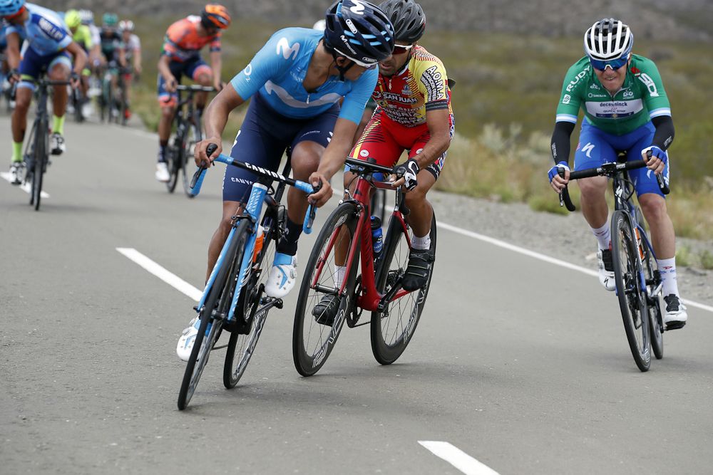 Richard Carapaz on the attack as Remco Evenepoel marks the move near the end of stage 5 in San Juan