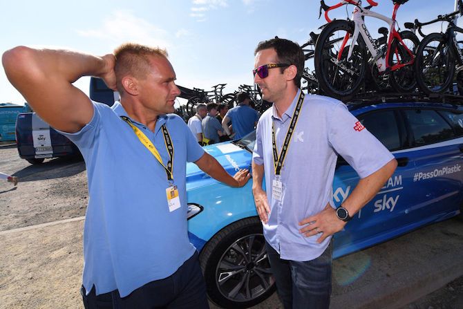 Joona Laukka (left) chats to the teams on stage 1 of the 2018 Tour de France