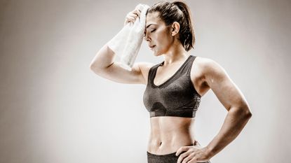 Woman doing 30-day fat-burn workout challenge