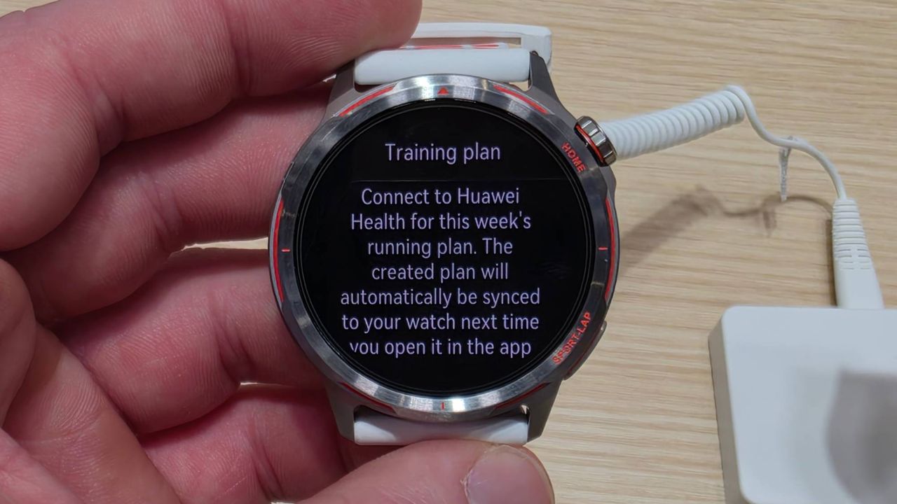 The Huawei Watch GT Runner 2 in a hand.