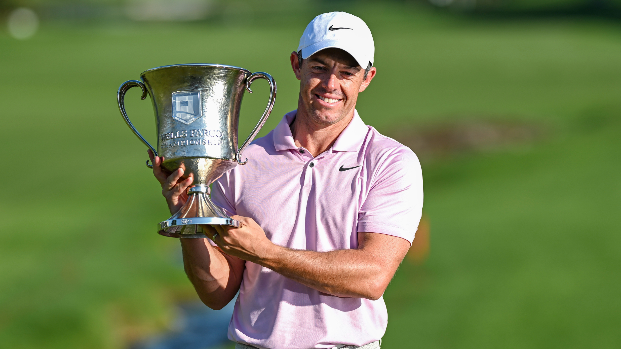Rory McIlroy with the Wells Fargo Championship trophy 