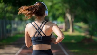 A woman jogging, seen from behind