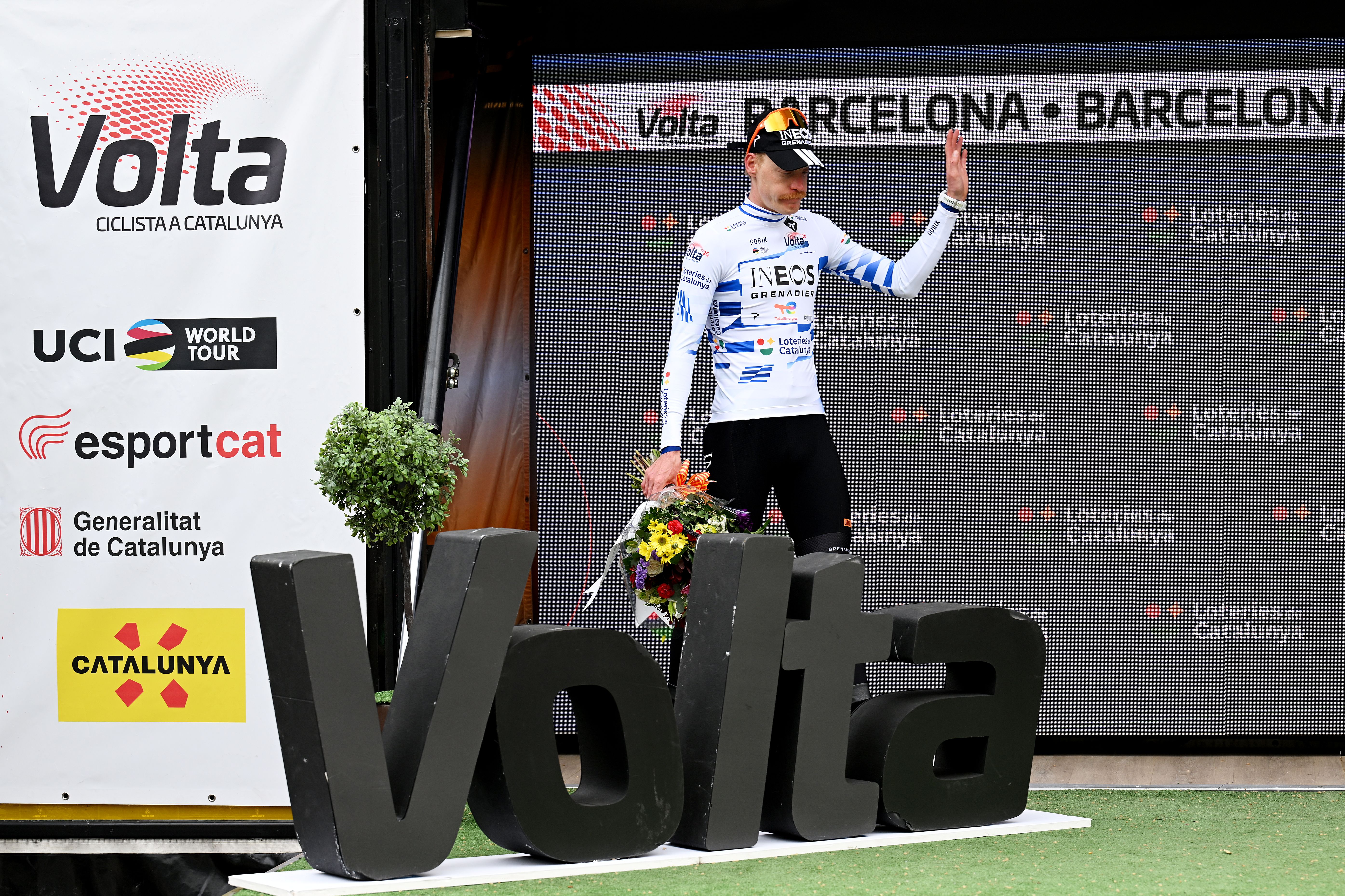 BARCELONA, SPAIN - MARCH 29: Dorian Godon of France and Team INEOS Grenadiers celebrates at podium as Blue Points Jersey winner during the 105th Volta a Catalunya 2026, Stage 7 a 95.1km stage from Barcelona to Barcelona / #UCIWT / on March 29, 2026 in Barcelona, Spain. (Photo by Szymon Gruchalski/Getty Images)