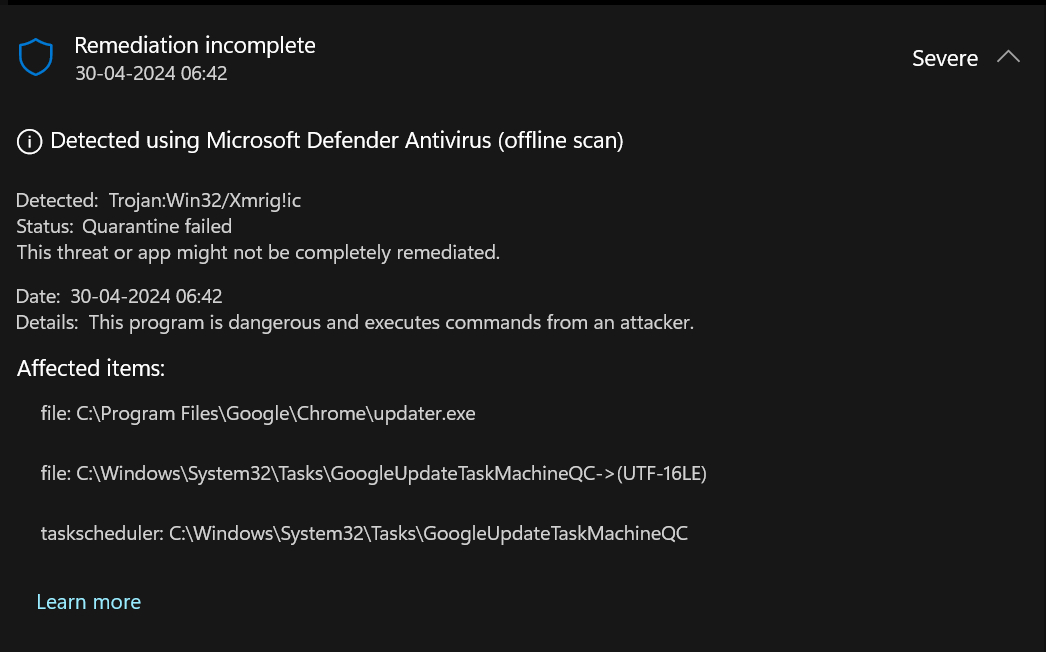Microsoft Defender Antivirus alert detailing a severe threat detected as "Trojan:Win32/Xmrig!ic" with quarantine failure.