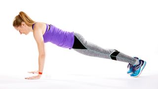 High plank: woman showing how to do a plank variation