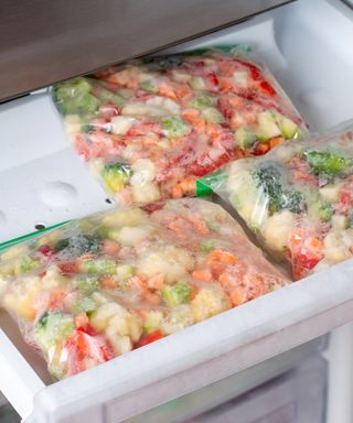 An image of a neatly organized freezer with bags of frozen food