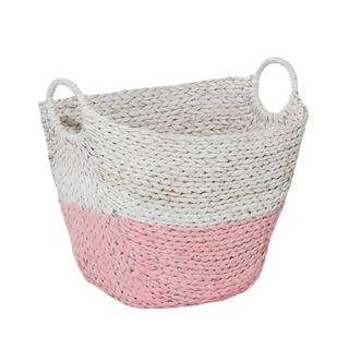 A white and pink seagrass storage basket