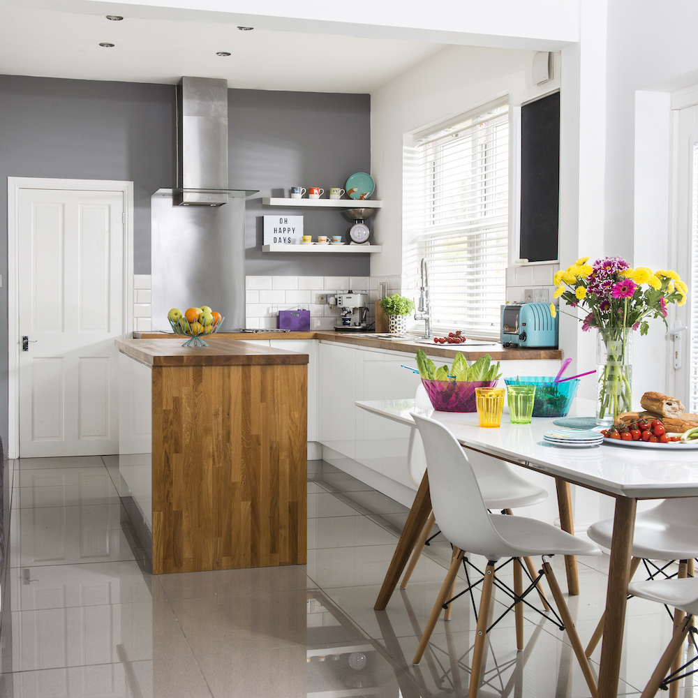 kitchen room with white tiled flooring and kitchen worktop