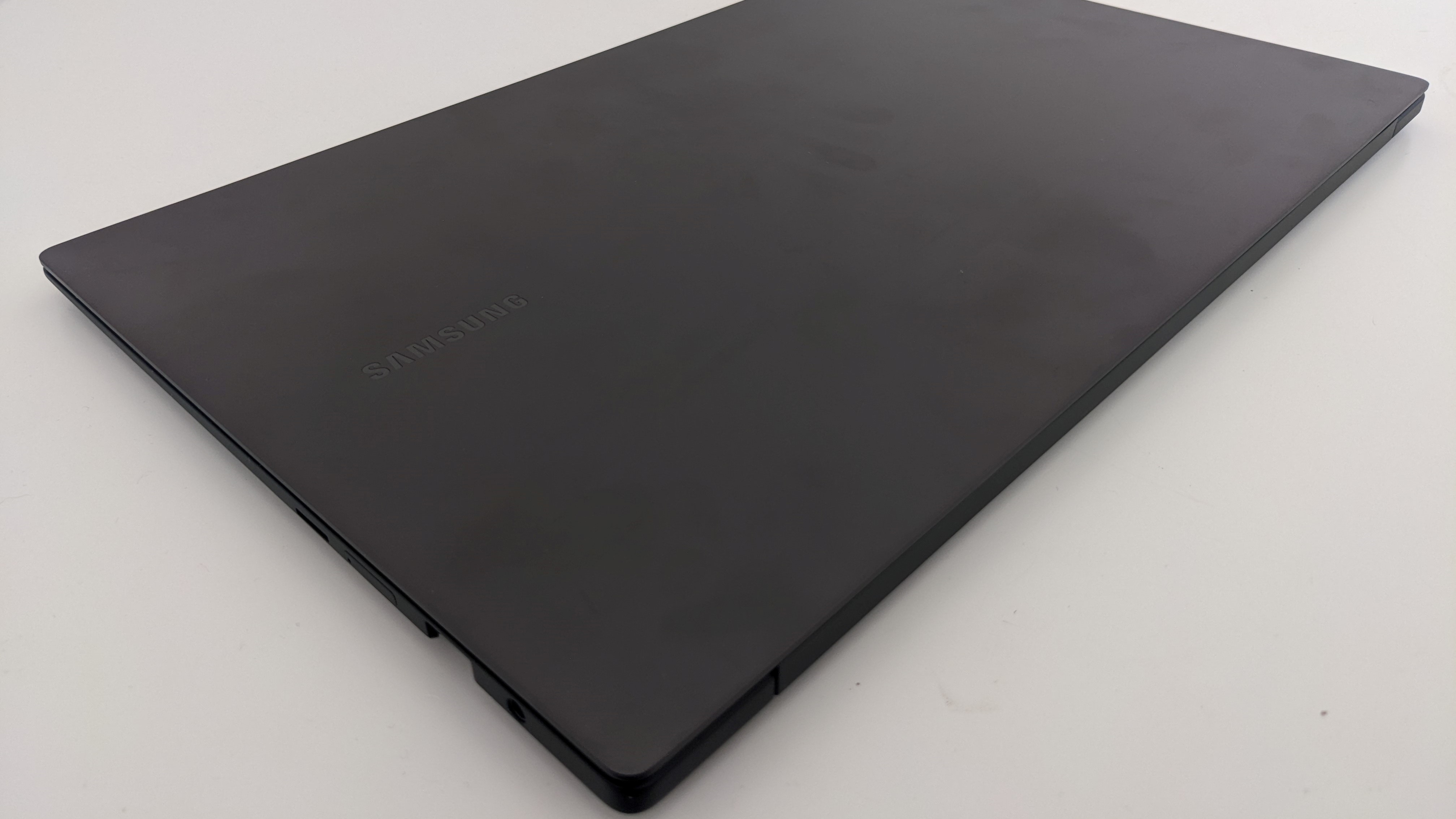 Samsung Galaxy Book2 Pro lid closed. Some smudged fingerprints are visible.