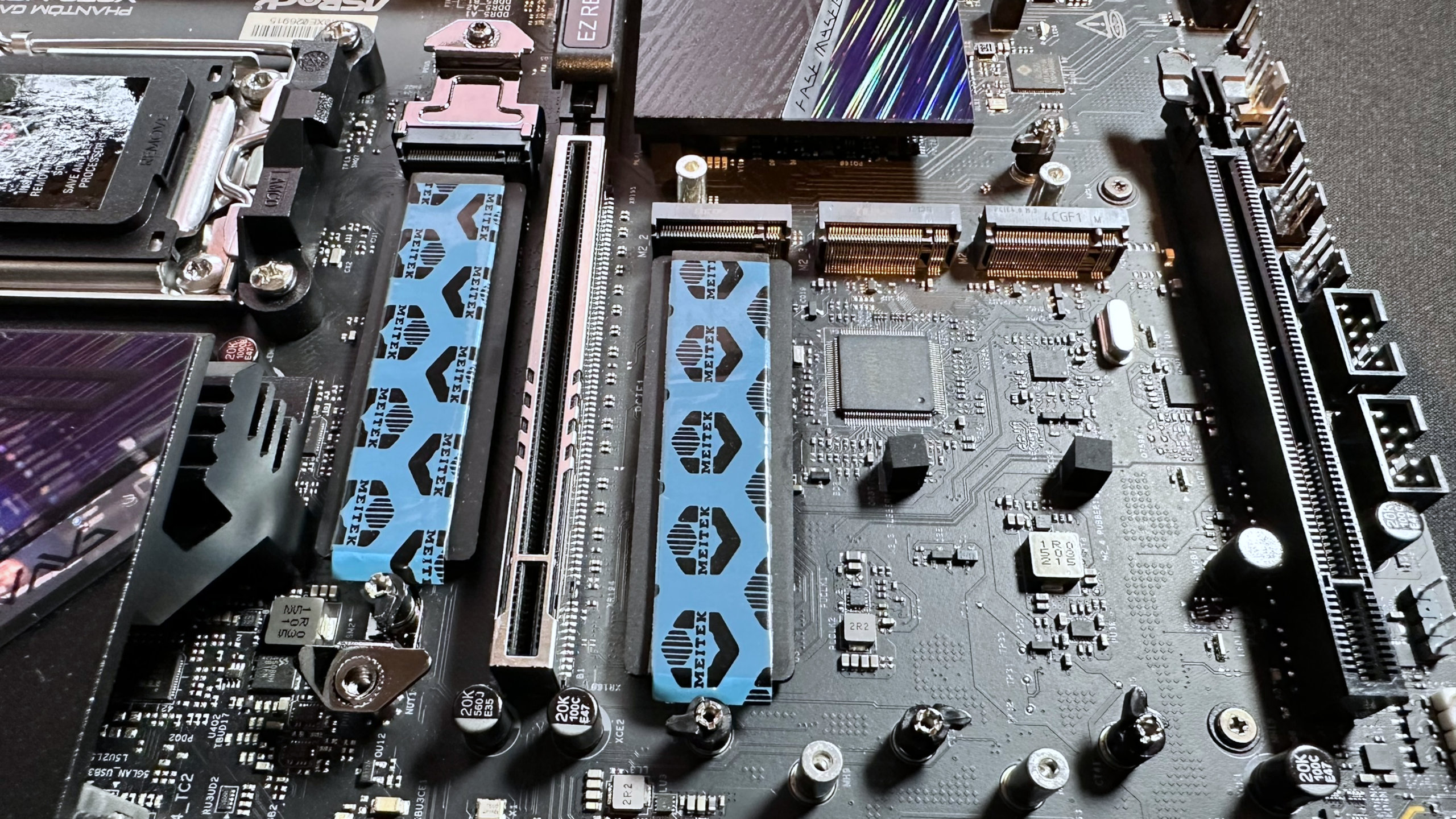 A close-up photo of four of the ASRock Phantom Gaming X870 Nova WIFI's M.2 slots