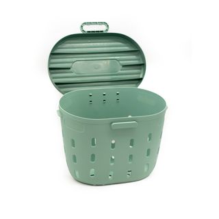 A green worm composter with the lid open