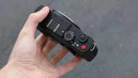 Panasonic Lumix S9 camera top down view held in a hand