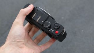 Panasonic Lumix S9 camera top down view held in a hand