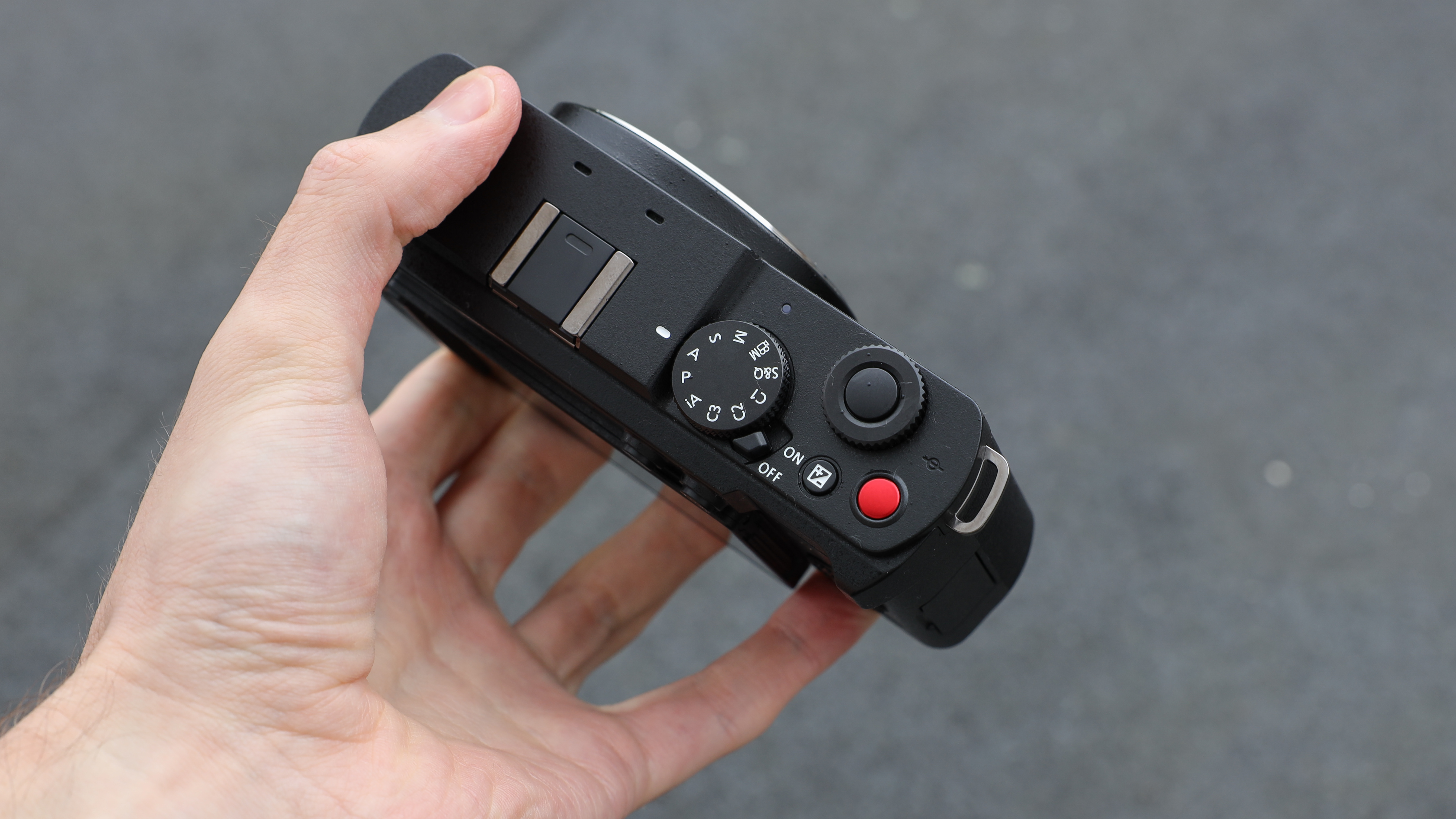 Panasonic Lumix S9 camera top down view held in a hand