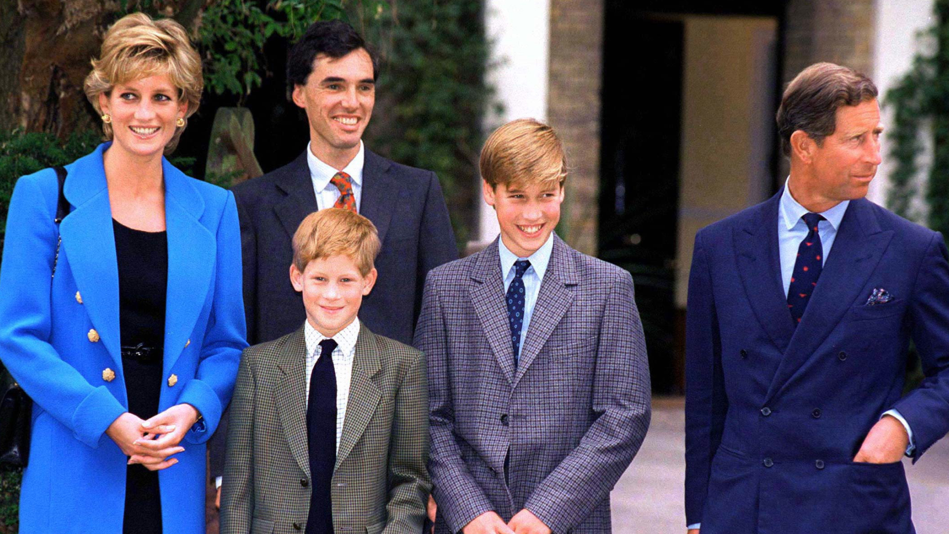 Princess Diana wears a blue jacket with a black dress while attending Eton College with Prince Harry, Prince William, and King Charles