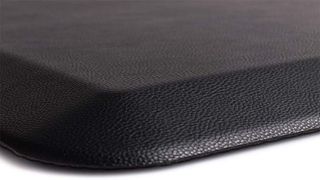 A black leather-like anti-fatigue mat