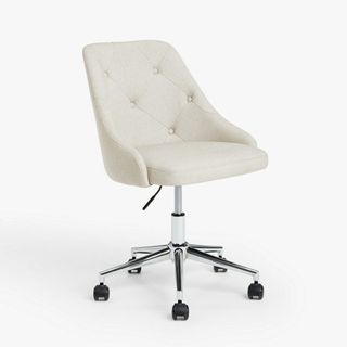 A white office chair with button detailing