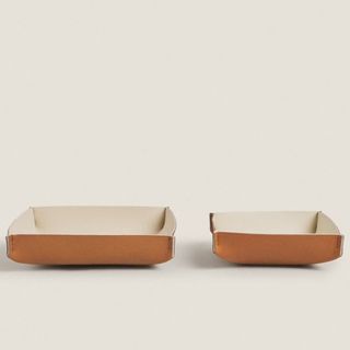 Two leather change holders that's a part of Zara Home's summer sale.