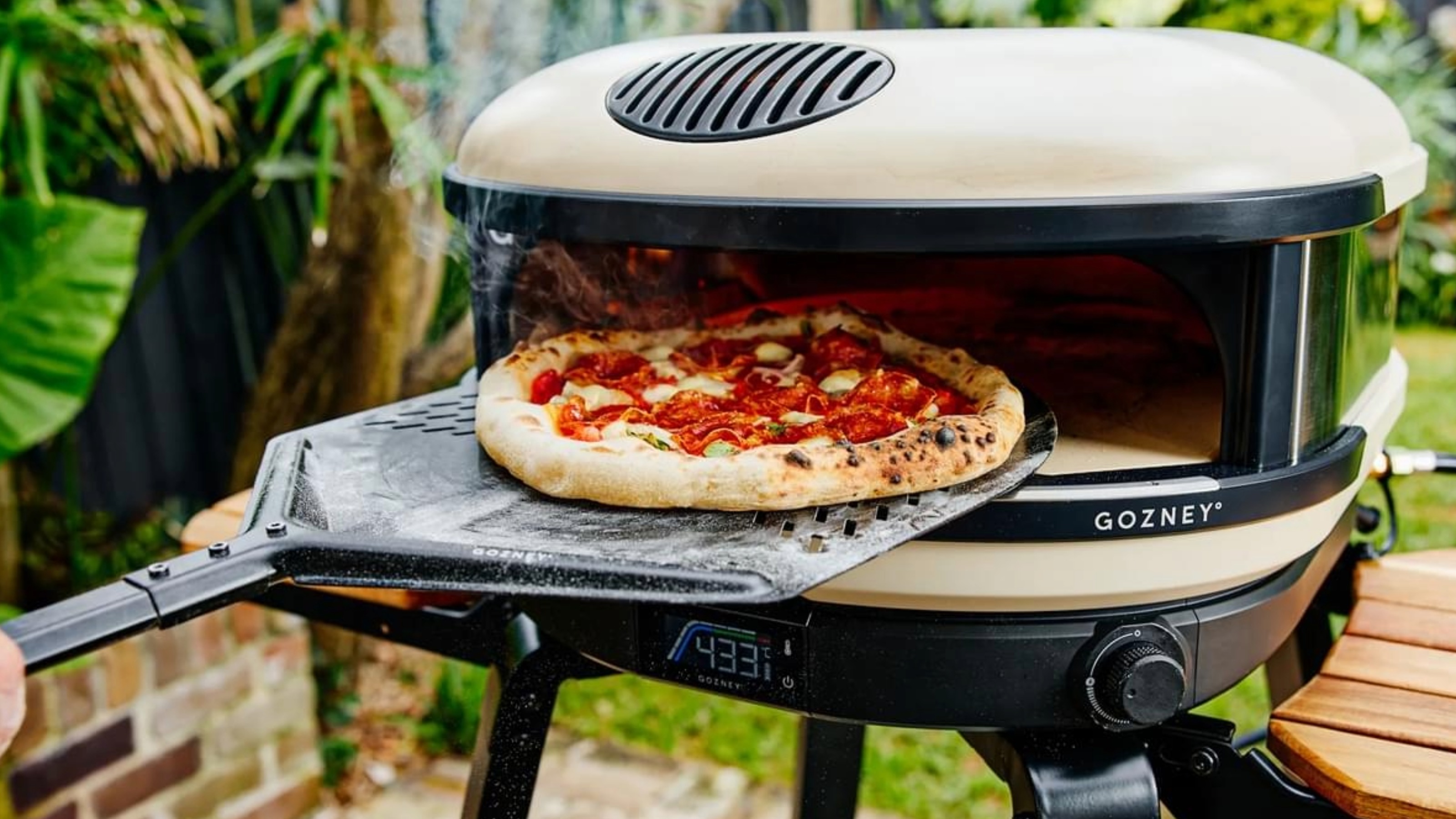 Gozney pizza oven with a pizza 