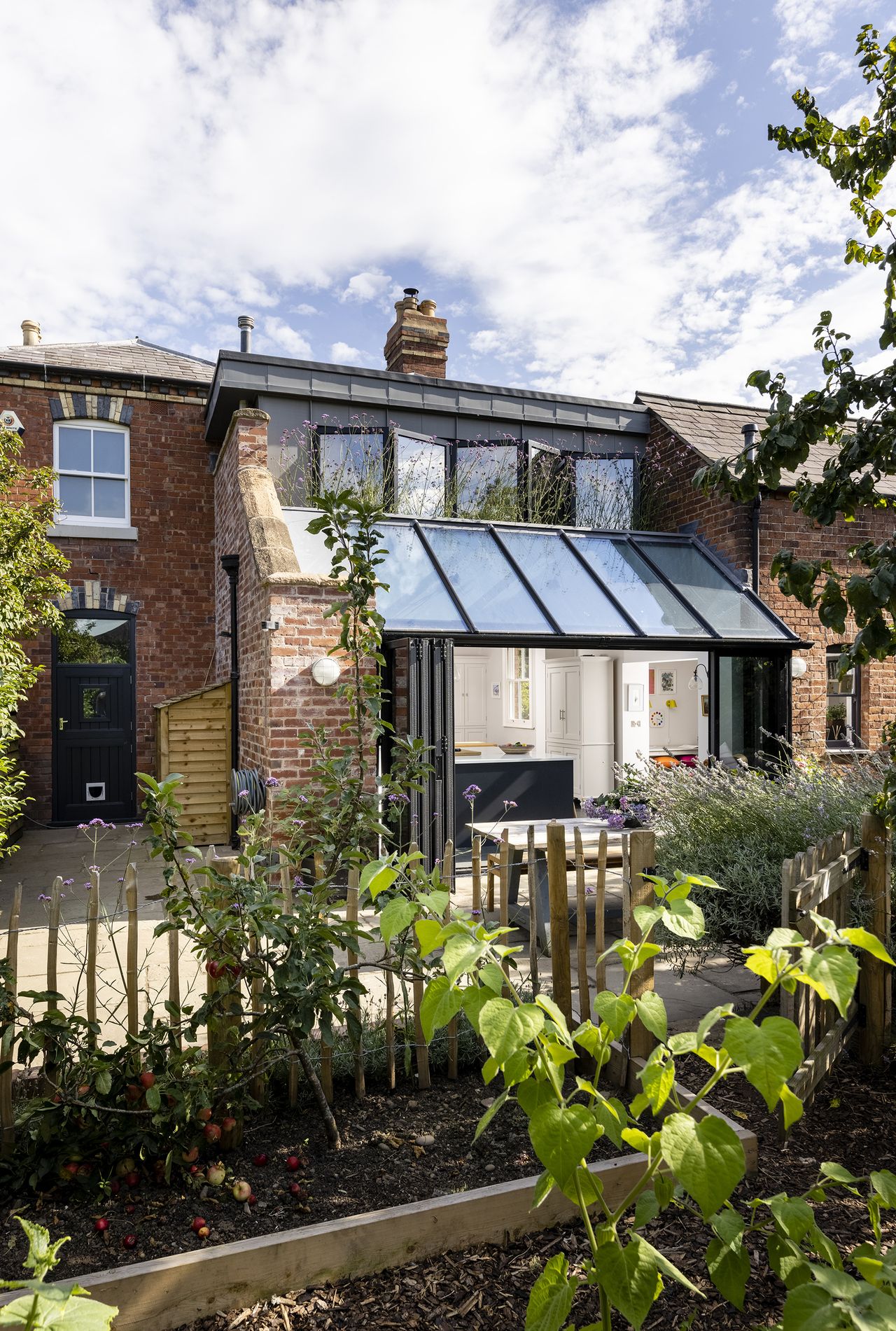 glass kitchen extension to brick traditional house