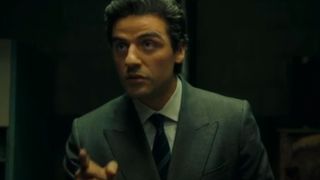 Oscar Isaac pointing with a serious expression in A Most Violent Year