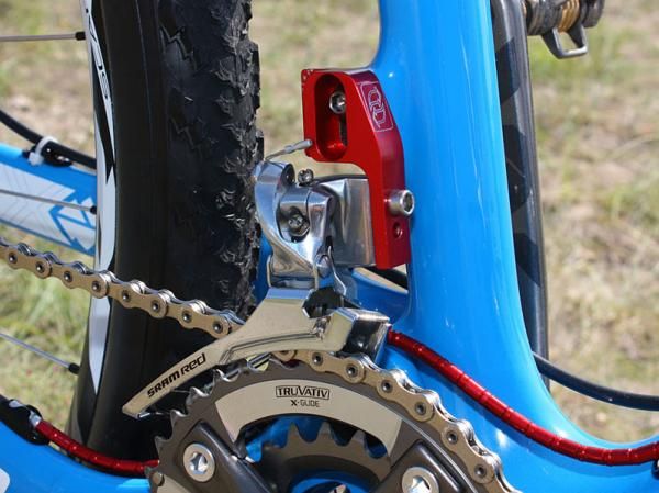 The steel-caged SRAM Red road front derailleur is adapted for use on the direct-mount frame with a custom mount made by a high-end automobile importer in New York.