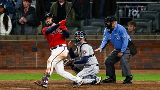 Travis d'Arnaud of the Atlanta Braves hitting a home run against the Houston Astros in the World Series
