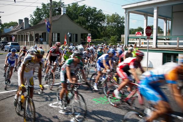 The peloton rolls out of Ste. Genevieve amongst historical homes.