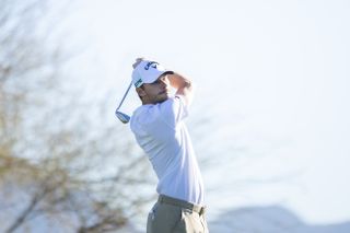 Nicolai Hojgaard hits an iron shot into the green