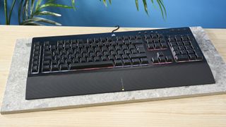 A black Corsair K55 RGB Pro wired gaming keyboard with rubber dome switches