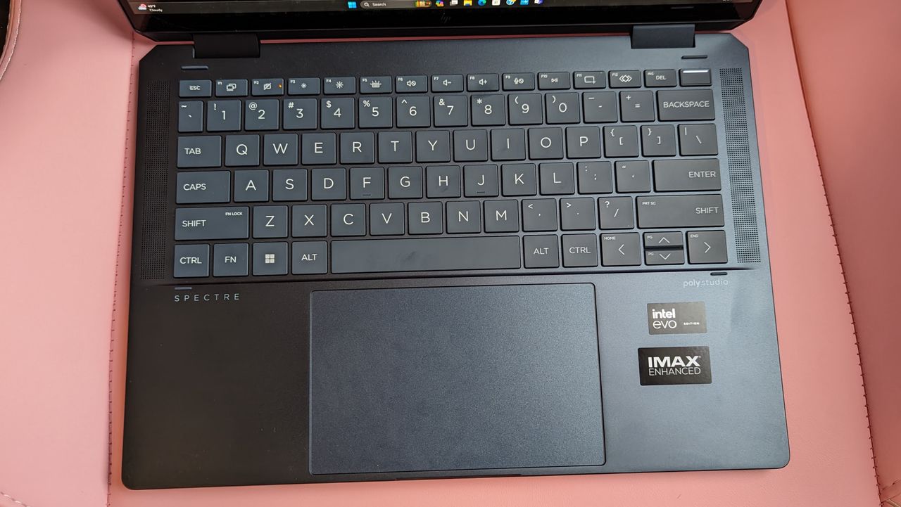 Top down shot of HP Spectre x360 14 2024 to show full keyboard and touchpad