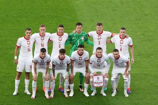 Poland's defender #14 Jakub Kiwior, Poland's forward #16 Adam Buksa, Poland's defender #05 Jan Bednarek, Poland's goalkeeper #01 Wojciech Szczesny, Poland's midfielder #03 Pawel Dawidowicz, Poland's midfielder #06 Jakub Piotrowski, (bottom from L) Poland's forward #23 Krzysztof Piatek, Poland's midfielder #21 Nicola Zalewski, Poland's midfielder #24 Bartosz Slisz, Poland's midfielder #10 Piotr Zielinski and Poland's defender #19 Przemyslaw Frankowski pose for a team picture during the UEFA Euro 2024 Group D football match between Poland and Austria at the Olympiastadion in Berlin on June 21, 2024.