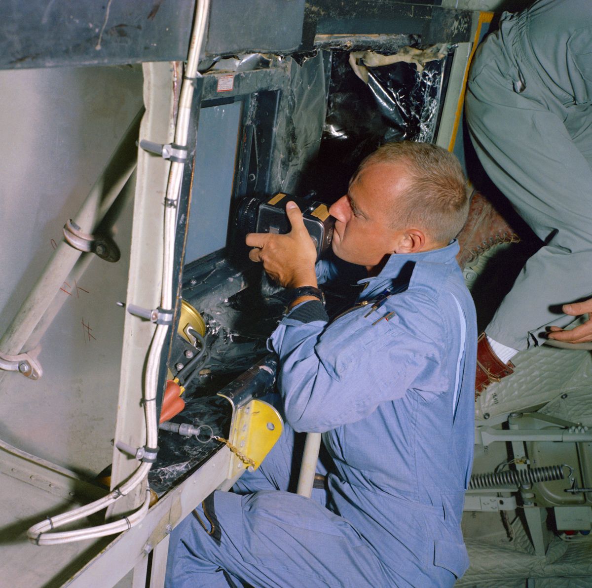 Gemini 5 pilot Pete Conrad takes pictures of predetermined land areas during visual acuity experiments over Laredo, Texas while in orbit on the record-setting mission in 1965.