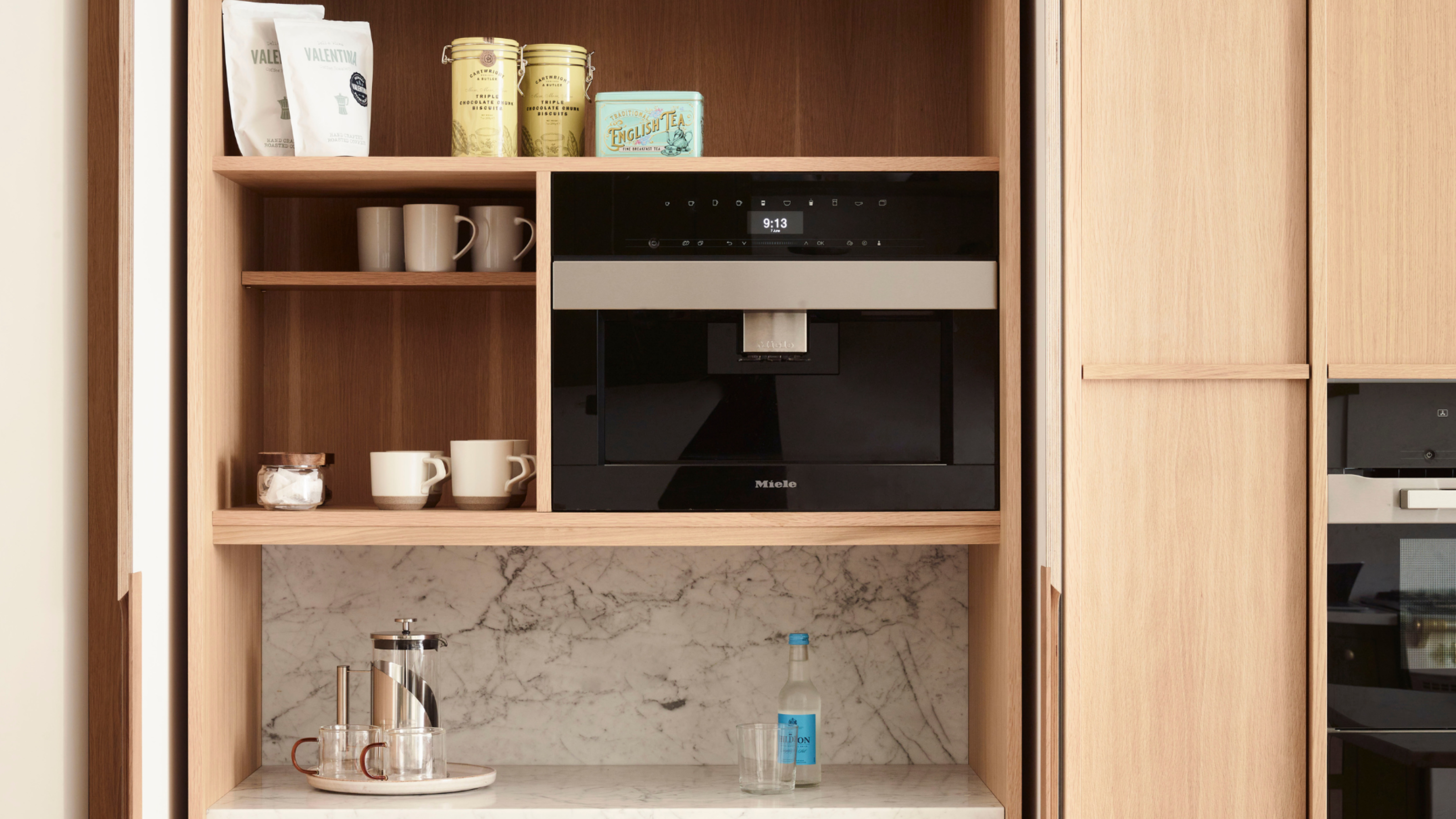 A llight oak double door breakfast bar with ample storage