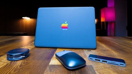 Indigo MacBook Neo with Satechi color matching accessories in front
