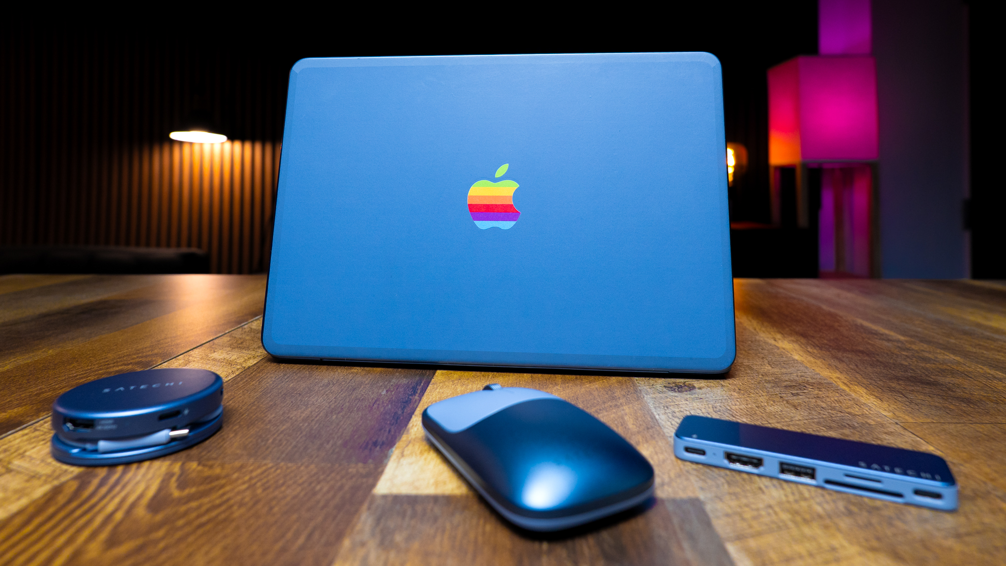 Indigo MacBook Neo with Satechi color matching accessories in front