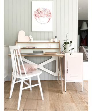 White puzzle desk with white wooden chair and pink cabinet by Melb Design Co.